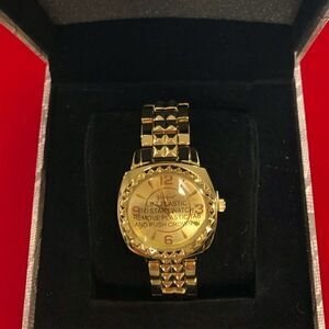 NEW WITH TAGS!! Wildlife gold-tone ladies wristwatch by Heidi Klum